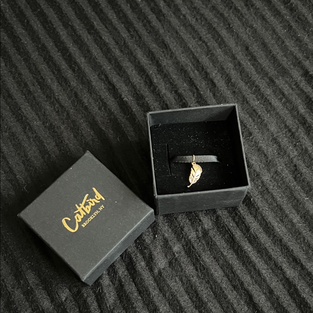 Catbird’s Swan’s Feather Charm